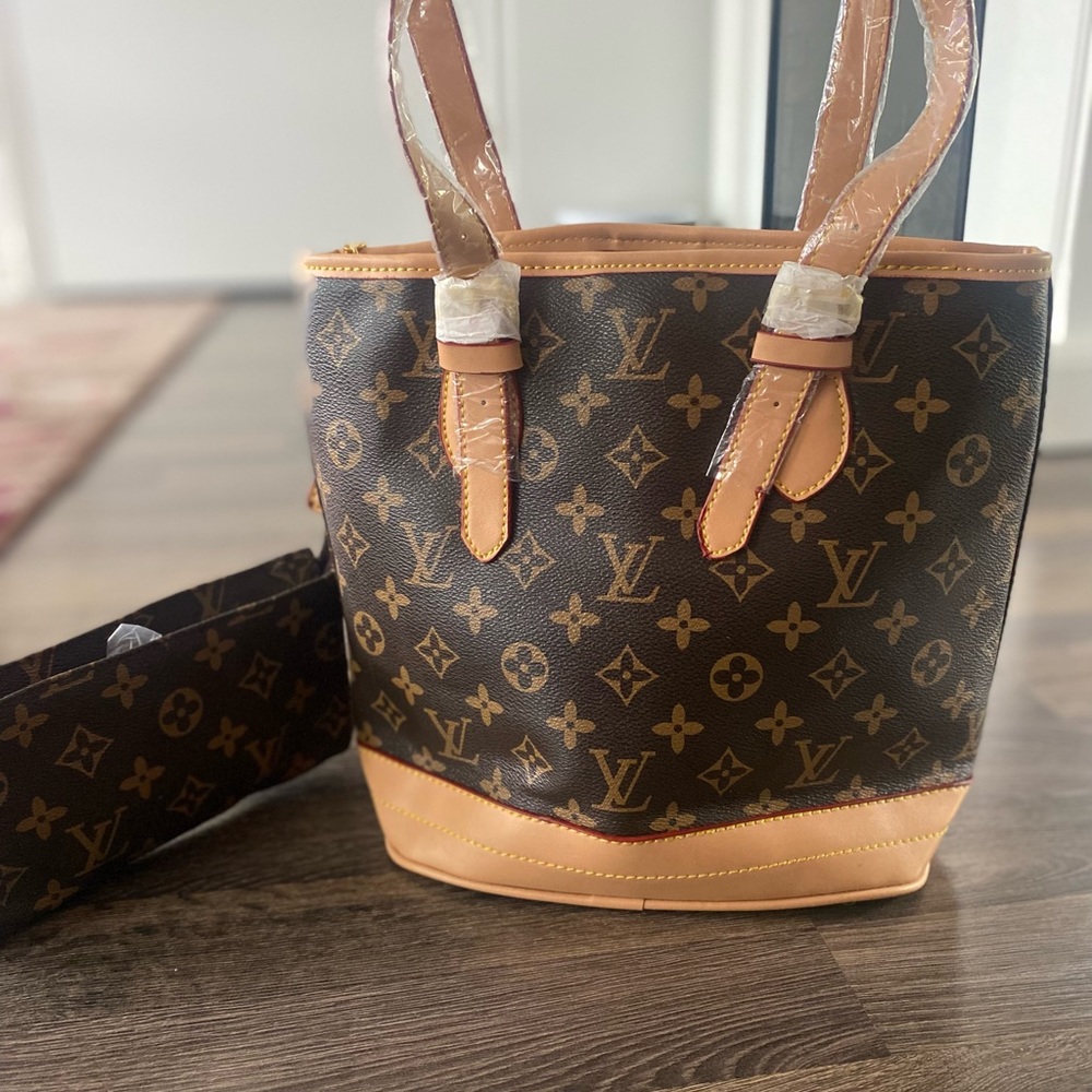 Designer bag with wallet inside.